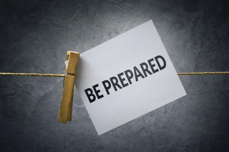 A Be Prepared note hooked to a line with a clothespin