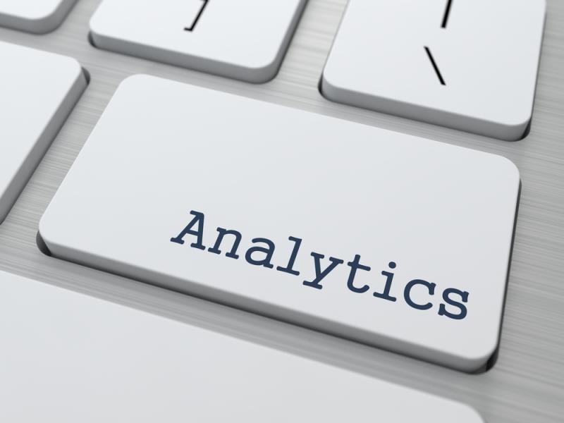 Image of a keyboard with a key labeled "Analytics" in bold blue text, surrounded by standard keys.