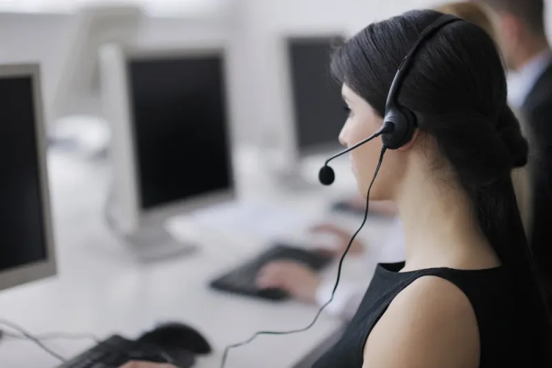 business people group with headphones giving support in help desk office to customers, manager giving training and education instructions