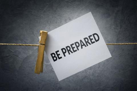 A Be Prepared note hooked to a line with a clothespin